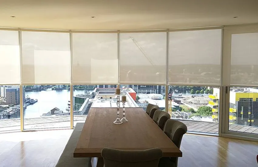 Sunscreen roller blinds in dining area
